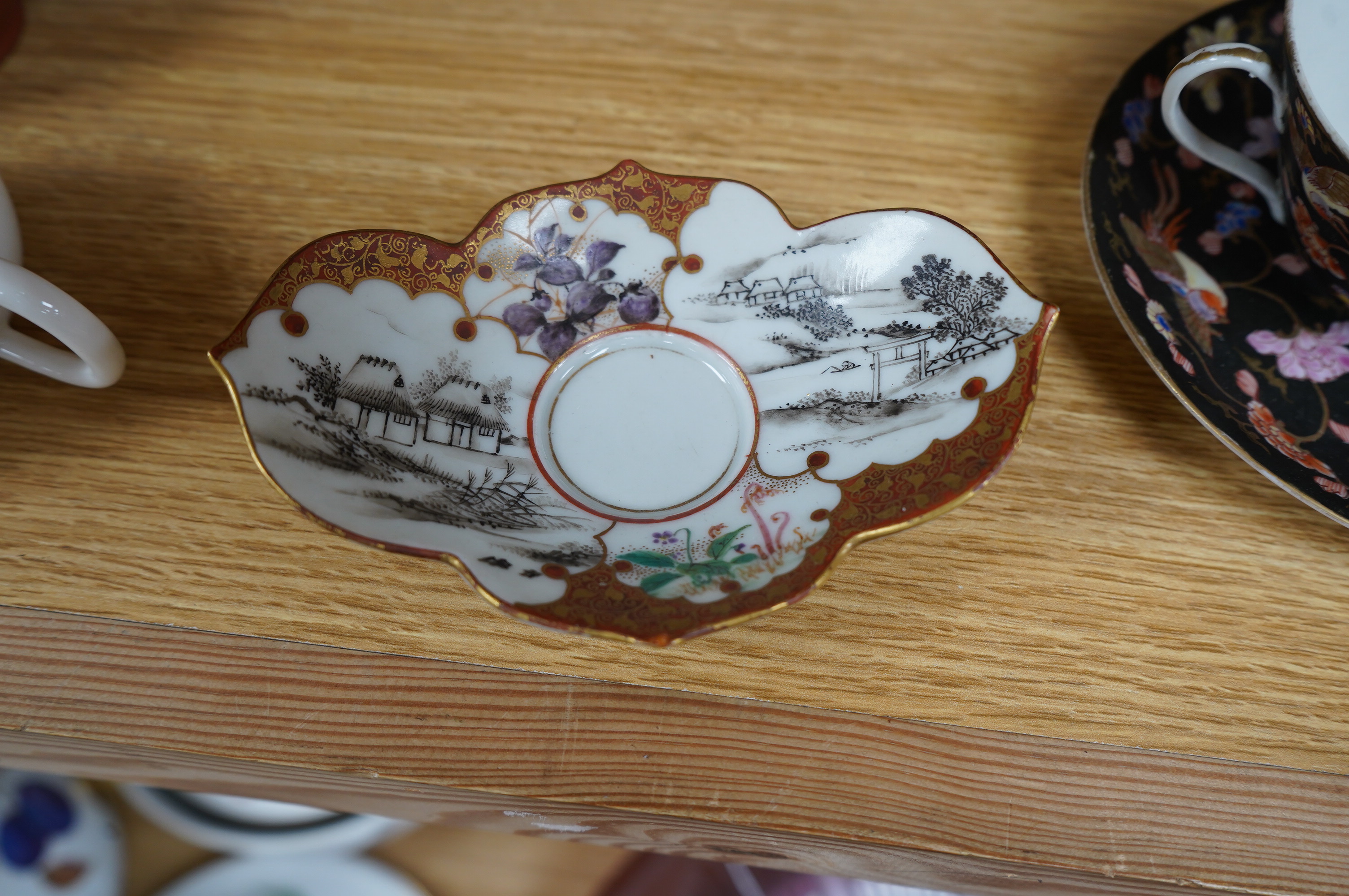 A group of Chinese and Japanese ceramics to include Yixing teapots, porcelain cups and saucers, a blue and white vase and a tiger talisman. Condition - mostly good